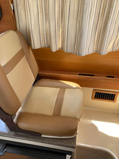 Come What May Yacht Photos Pics 2019 Ranger Tugs R-29 CB Luxury Edition interior with beige and brown seating.