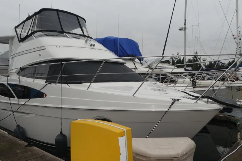  Yacht Photos Pics 2006 Carver 366 Motor Yacht docked at marina, featuring sleek design and spacious cabin.