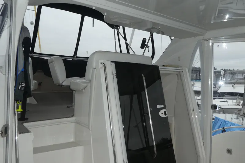  Yacht Photos Pics 2006 Carver 366 Motor Yacht interior with seating and helm, docked at marina.