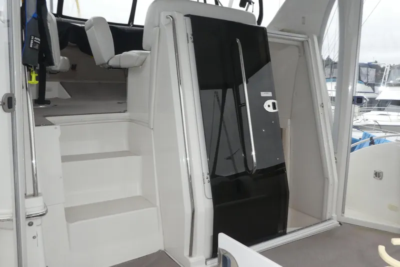  Yacht Photos Pics Interior view of 2006 Carver 366 Motor Yacht with stairs and seating area.