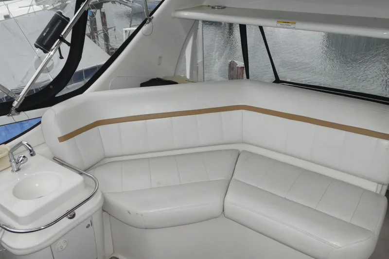  Yacht Photos Pics 2006 Carver 366 Motor Yacht interior with white seating and small sink.