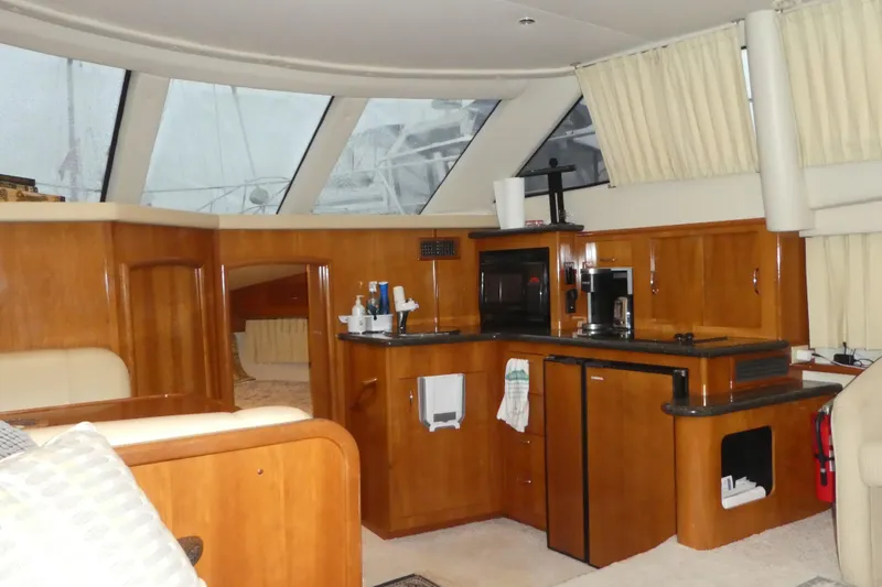  Yacht Photos Pics Interior of 2006 Carver 366 Motor Yacht with wooden cabinetry and modern amenities.