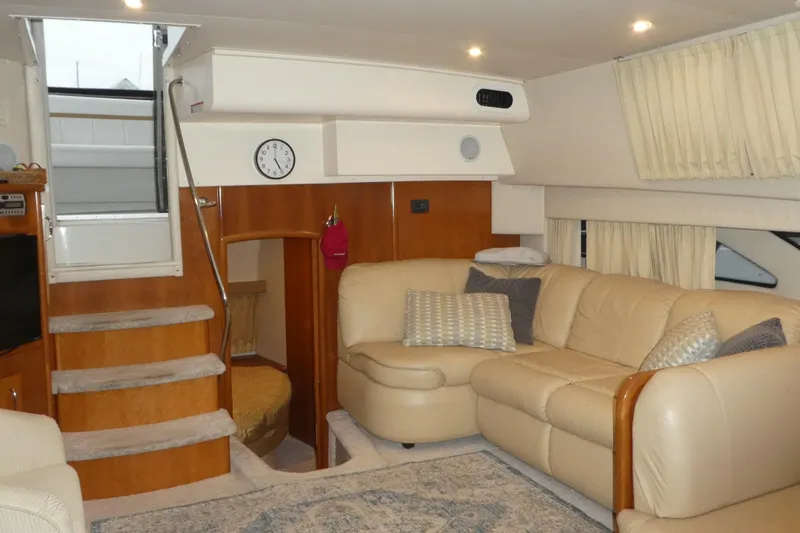  Yacht Photos Pics Luxurious interior of 2006 Carver 366 Motor Yacht with beige leather seating and wooden accents.
