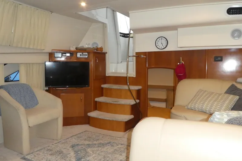  Yacht Photos Pics Luxurious interior of 2006 Carver 366 Motor Yacht with cozy seating and entertainment area.