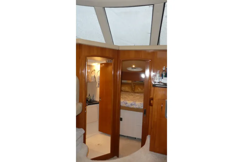  Yacht Photos Pics Interior of 2006 Carver 366 Motor Yacht with wood finish and cozy bedroom.
