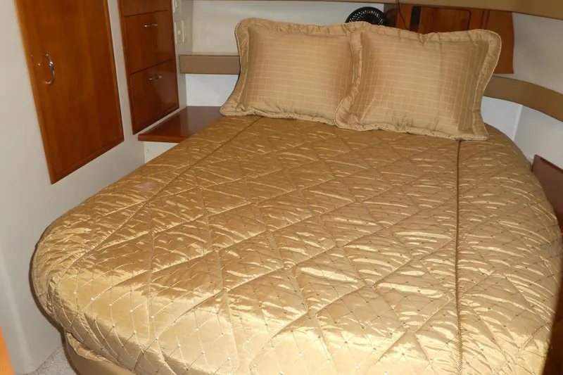  Yacht Photos Pics Luxurious bedroom interior of 2006 Carver 366 Motor Yacht with gold bedding.