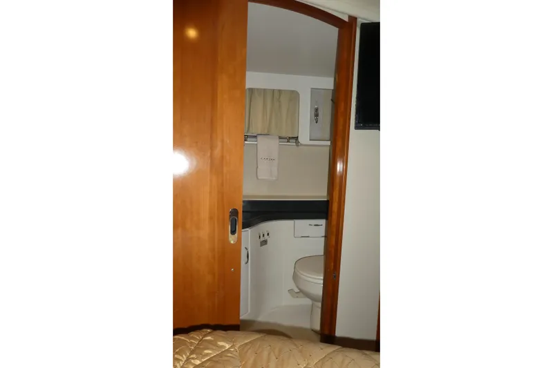  Yacht Photos Pics 2006 Carver 366 Motor Yacht bathroom with wooden door and compact design.