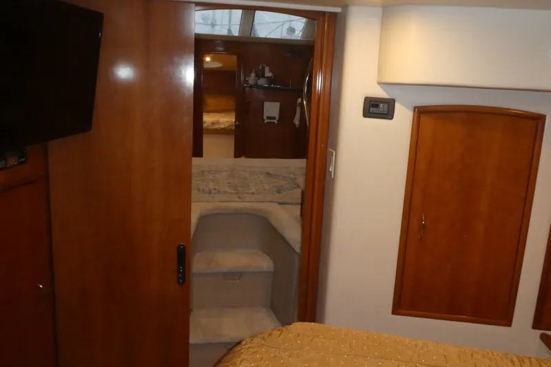  Yacht Photos Pics Interior of 2006 Carver 366 Motor Yacht with wood paneling and cozy cabin space.