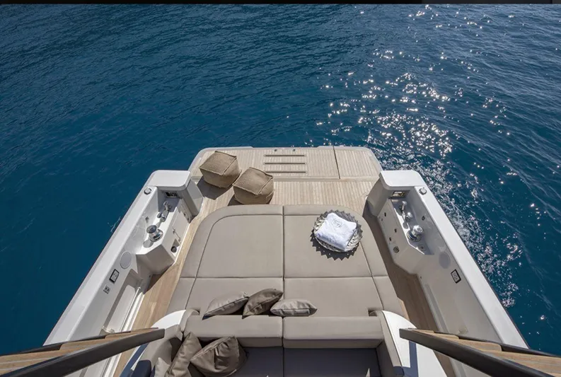 Yacht Photos Pics Luxurious 2021 Bluegame BG42 yacht deck with sun loungers and ocean view.