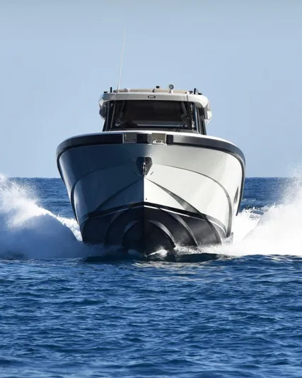  Yacht Photos Pics 2021 Bluegame BG42 yacht cruising on open water, front view.