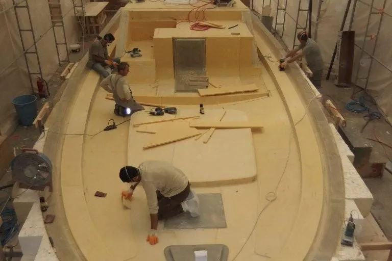 Aida 46 Sport Yacht Photos Pics Workers constructing a Custom AIDA YACHTS 46 SPORT, 2026 model, in a shipyard.
