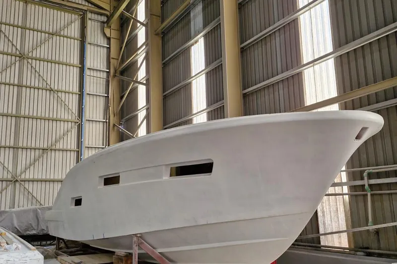 Aida 46 Sport Yacht Photos Pics AIDA YACHTS 46 SPORT 2026 model under construction in a large indoor facility.