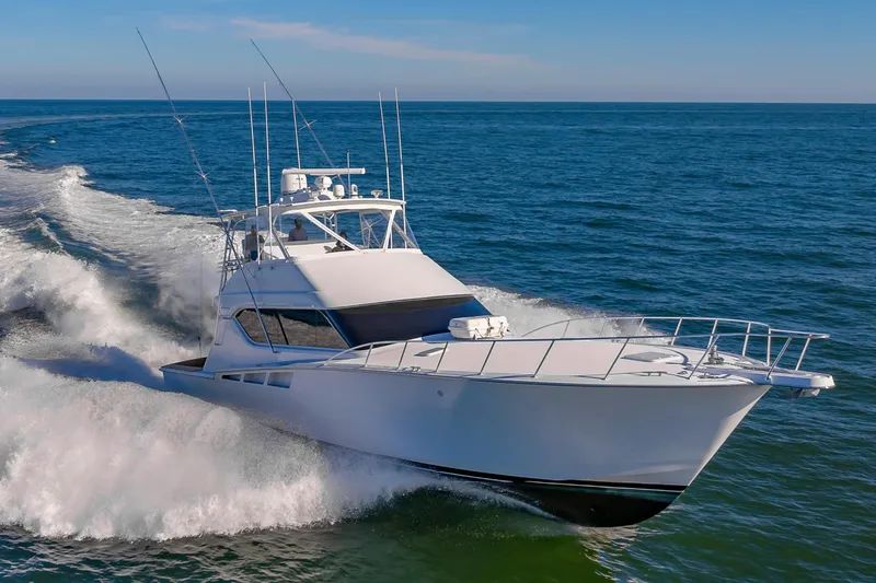 Sea Trader Yacht Photos Pics 2005 Hatteras 60 Convertible yacht cruising on open sea.