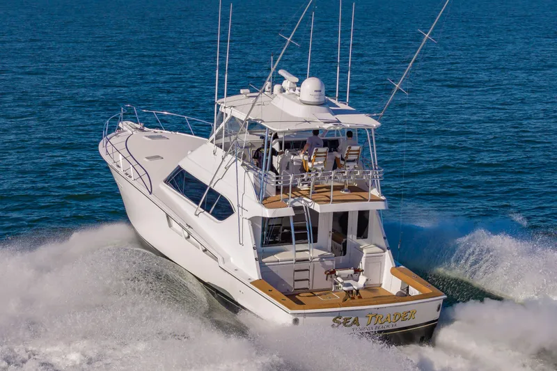 Sea Trader Yacht Photos Pics 2005 Hatteras 60 Convertible yacht cruising on open water.