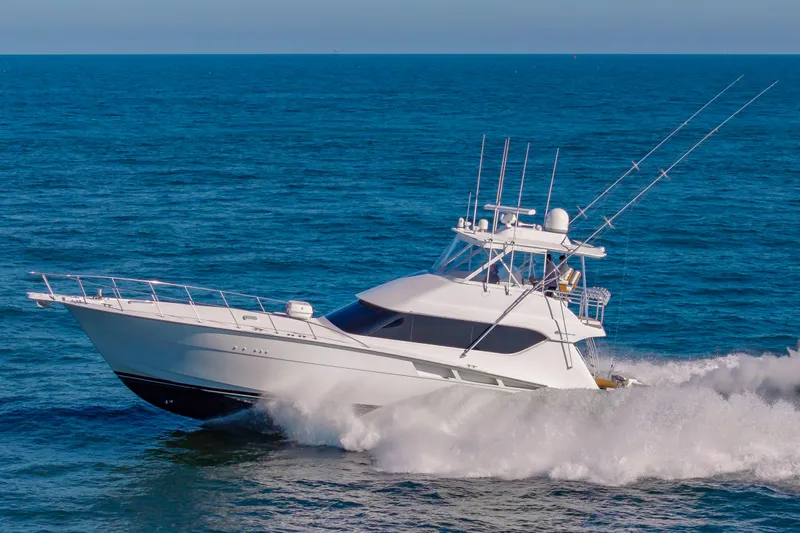 Sea Trader Yacht Photos Pics 2005 Hatteras 60 Convertible yacht cruising on open sea.