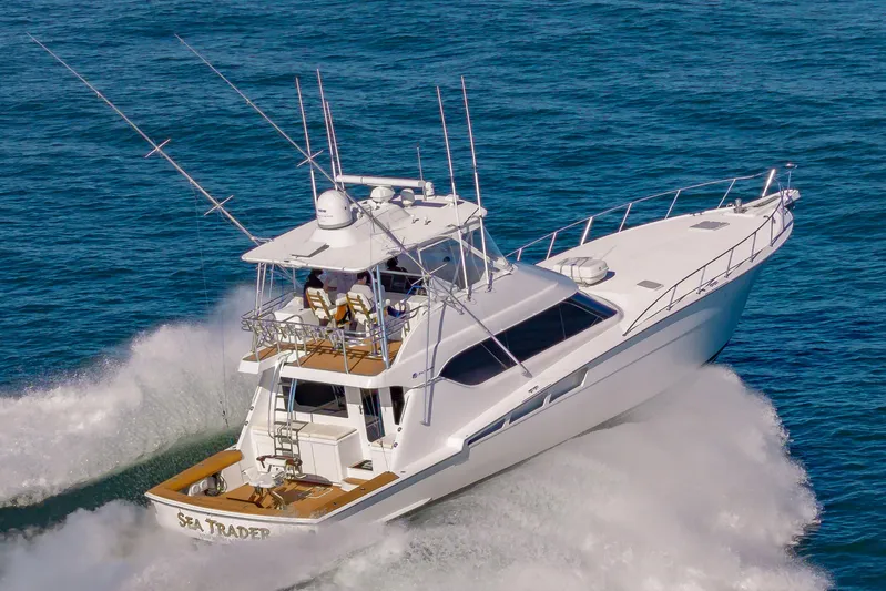 Sea Trader Yacht Photos Pics 2005 Hatteras 60 Convertible yacht cruising on open water.