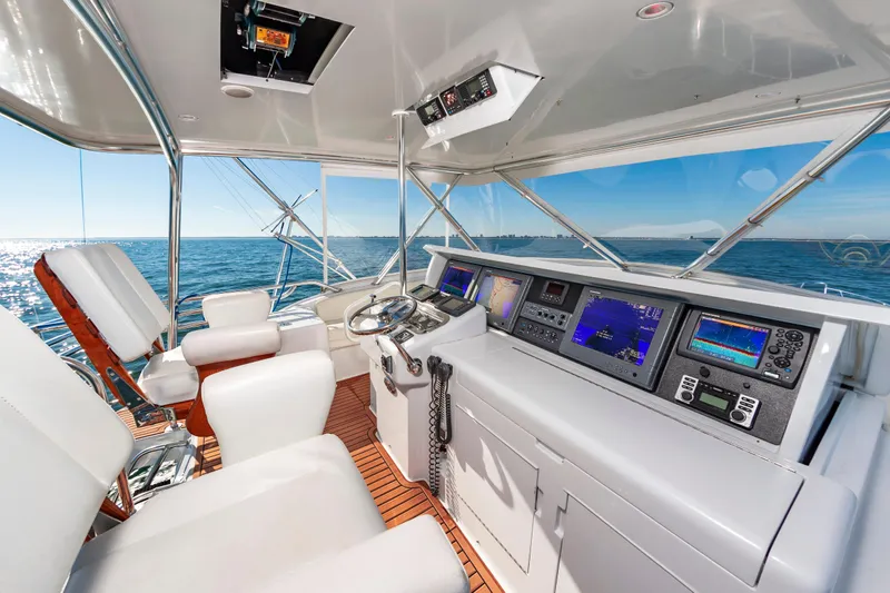 Sea Trader Yacht Photos Pics Luxurious 2005 Hatteras 60 Convertible yacht helm with advanced navigation systems.