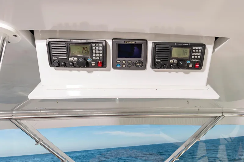 Sea Trader Yacht Photos Pics Hatteras 60 Convertible 2005 yacht dashboard with navigation equipment and ocean view.