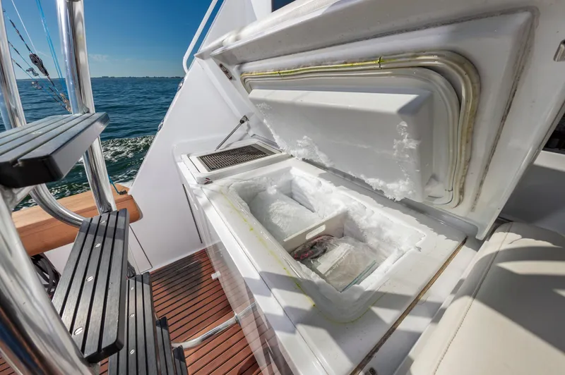 Sea Trader Yacht Photos Pics Open freezer on 2005 Hatteras 60 Convertible yacht deck, ocean view.