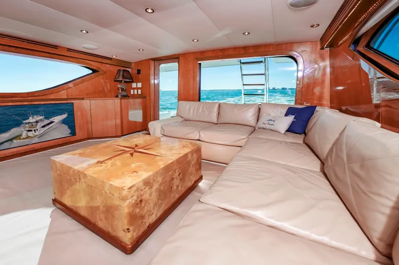 Sea Trader Yacht Photos Pics Luxurious interior of 2005 Hatteras 60 Convertible yacht with ocean view.