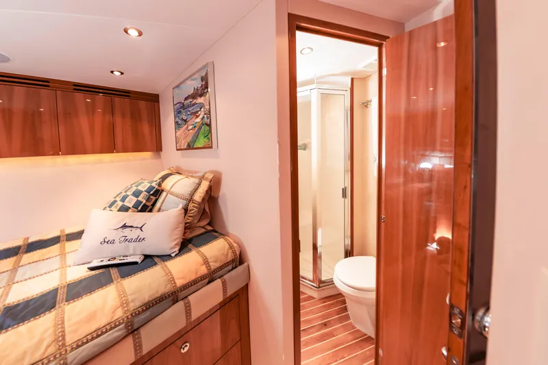 Sea Trader Yacht Photos Pics Luxurious cabin interior of 2005 Hatteras 60 Convertible yacht with ensuite bathroom.