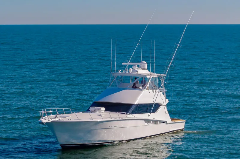 Sea Trader Yacht Photos Pics 2005 Hatteras 60 Convertible yacht cruising on open sea.