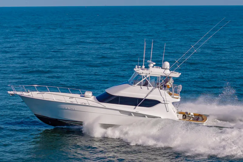 Sea Trader Yacht Photos Pics 2005 Hatteras 60 Convertible yacht cruising on open sea.