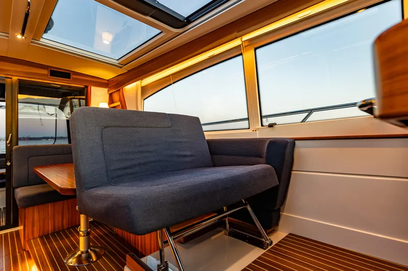 Treasure State Yacht Photos Pics Interior of 2022 Nimbus 405 Coup&eacute; yacht with modern seating and large windows.