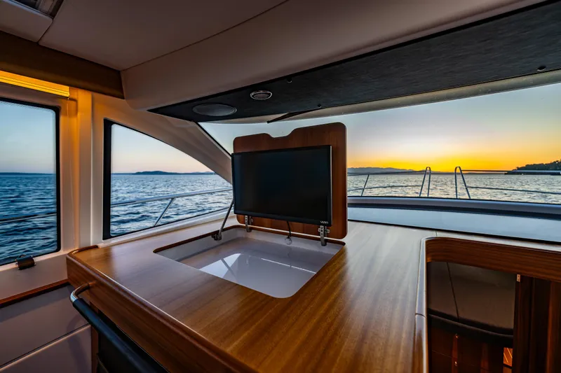 Treasure State Yacht Photos Pics Interior of 2022 Nimbus 405 Coup&eacute; yacht with sunset ocean view.