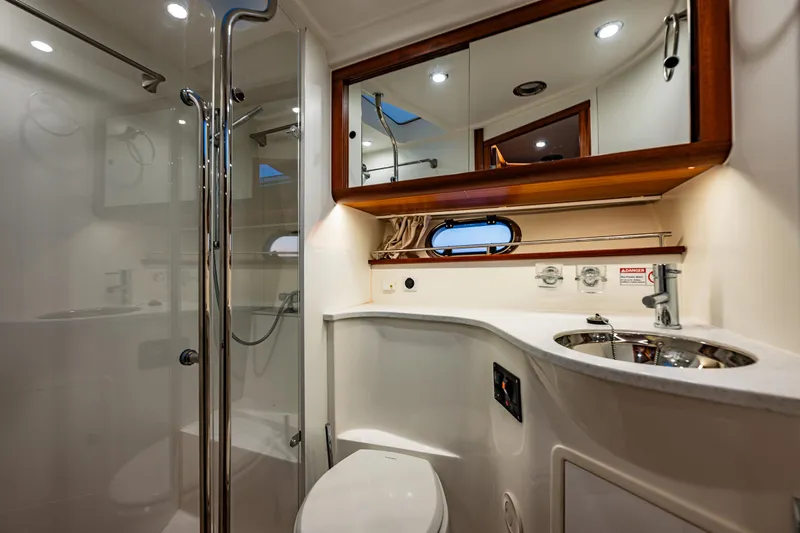 Treasure State Yacht Photos Pics Luxurious bathroom interior of 2022 Nimbus 405 Coup&eacute; yacht with modern fixtures.