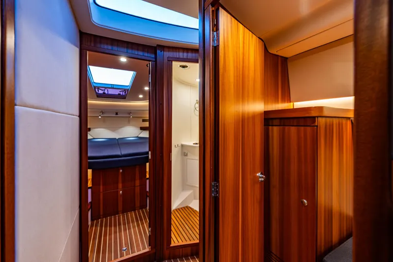 Treasure State Yacht Photos Pics Luxurious interior of 2022 Nimbus 405 Coup&eacute; yacht with wood finish and modern amenities.