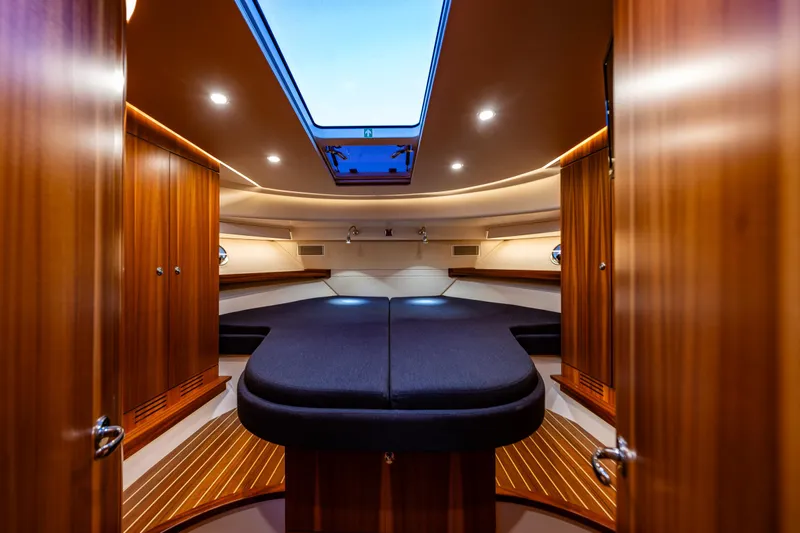 Treasure State Yacht Photos Pics Luxurious interior of 2022 Nimbus 405 Coup&eacute; yacht with elegant wood finish and skylight.