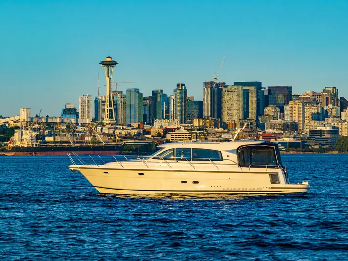 Treasure State Yacht Photos Pics Nimbus 405 Coupé yacht on Seattle waters with city skyline backdrop, 2022 model.