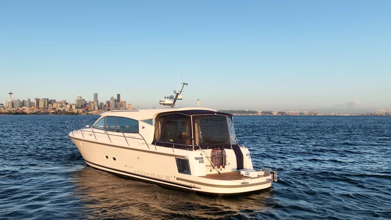 Treasure State Yacht Photos Pics 2022 Nimbus 405 Coup&eacute; yacht on water with city skyline in background.