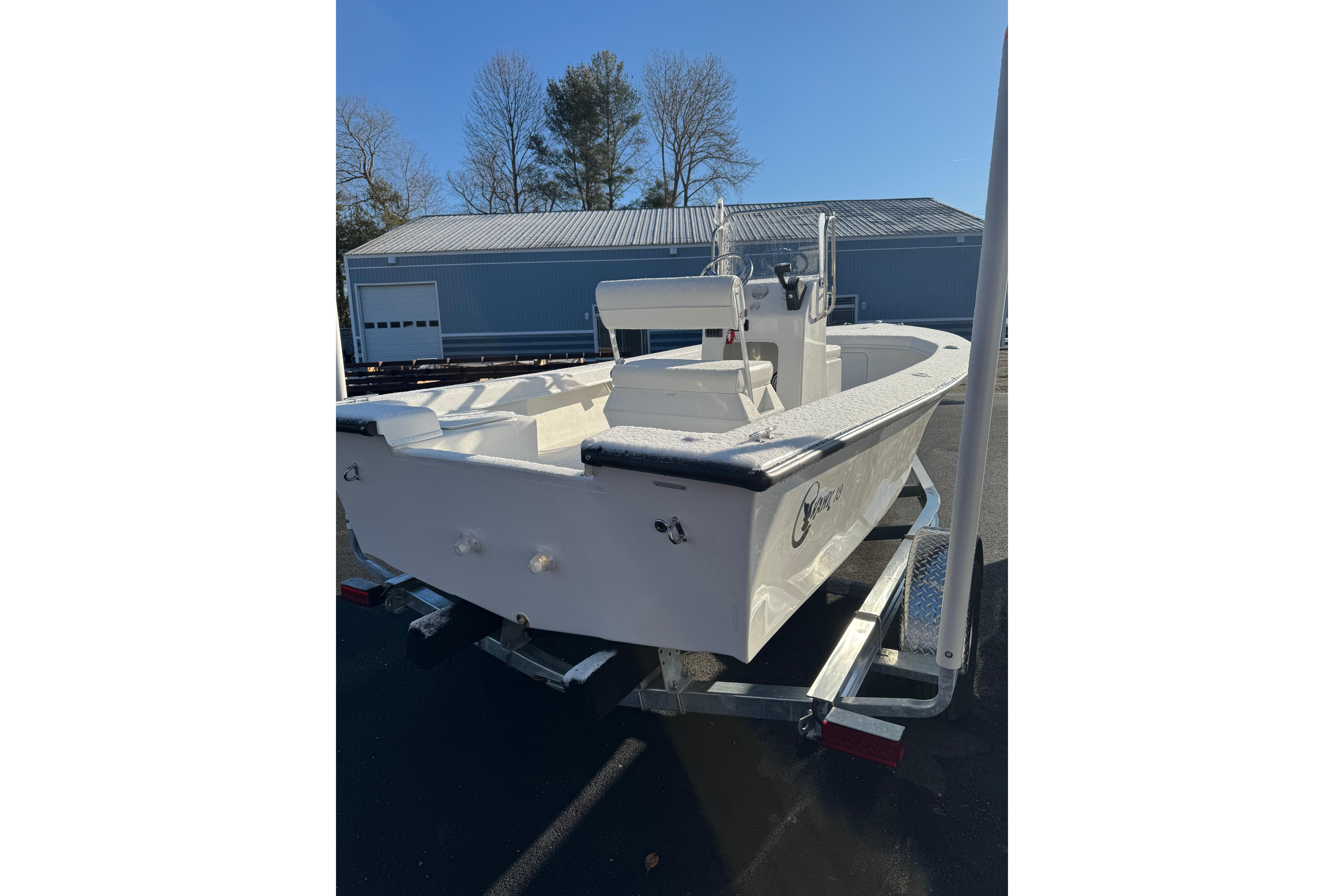 2026 C-Hawk 18 Center Console boat on trailer, parked outdoors.