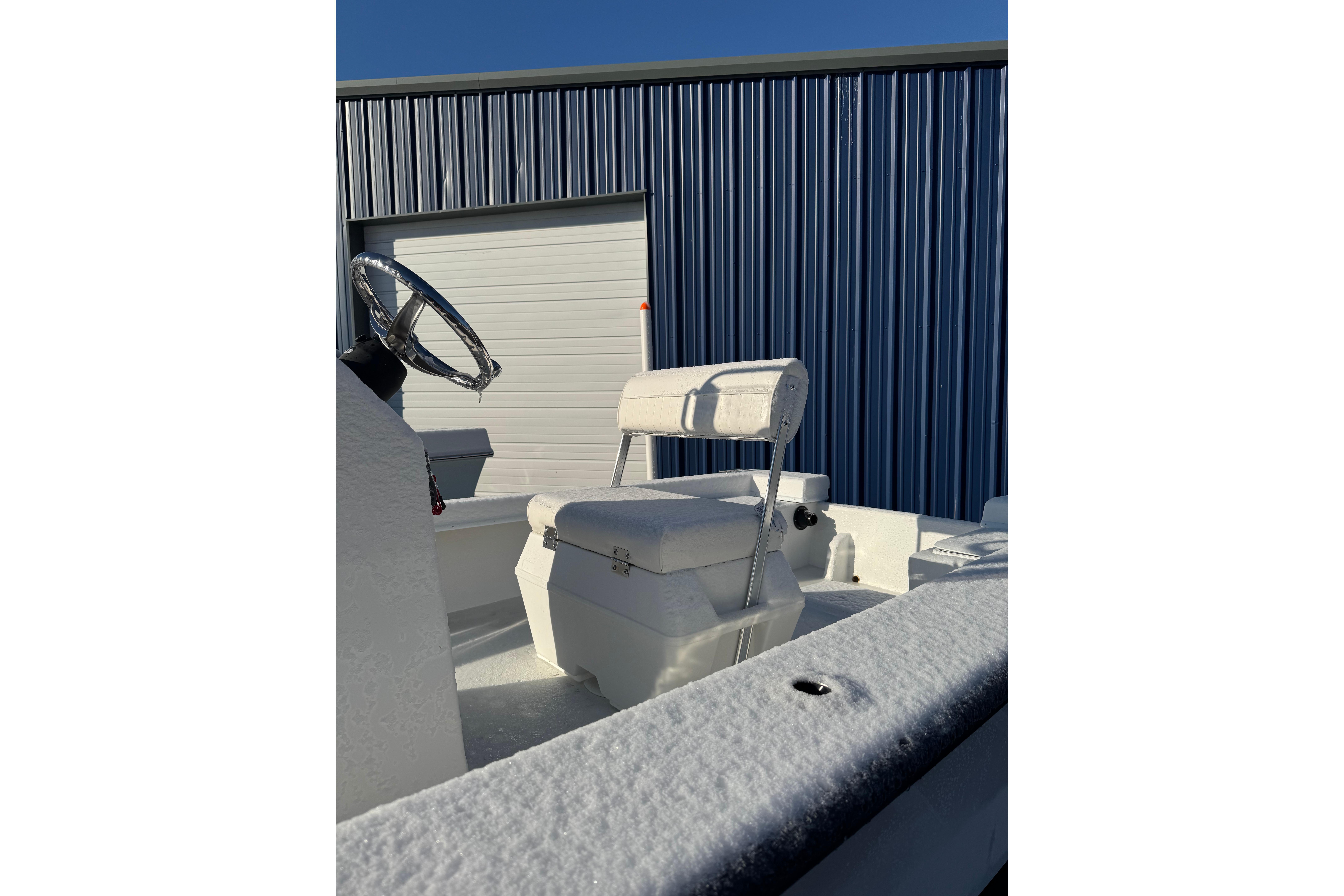 2026 C-Hawk 18 Center Console boat interior with steering wheel and seating.