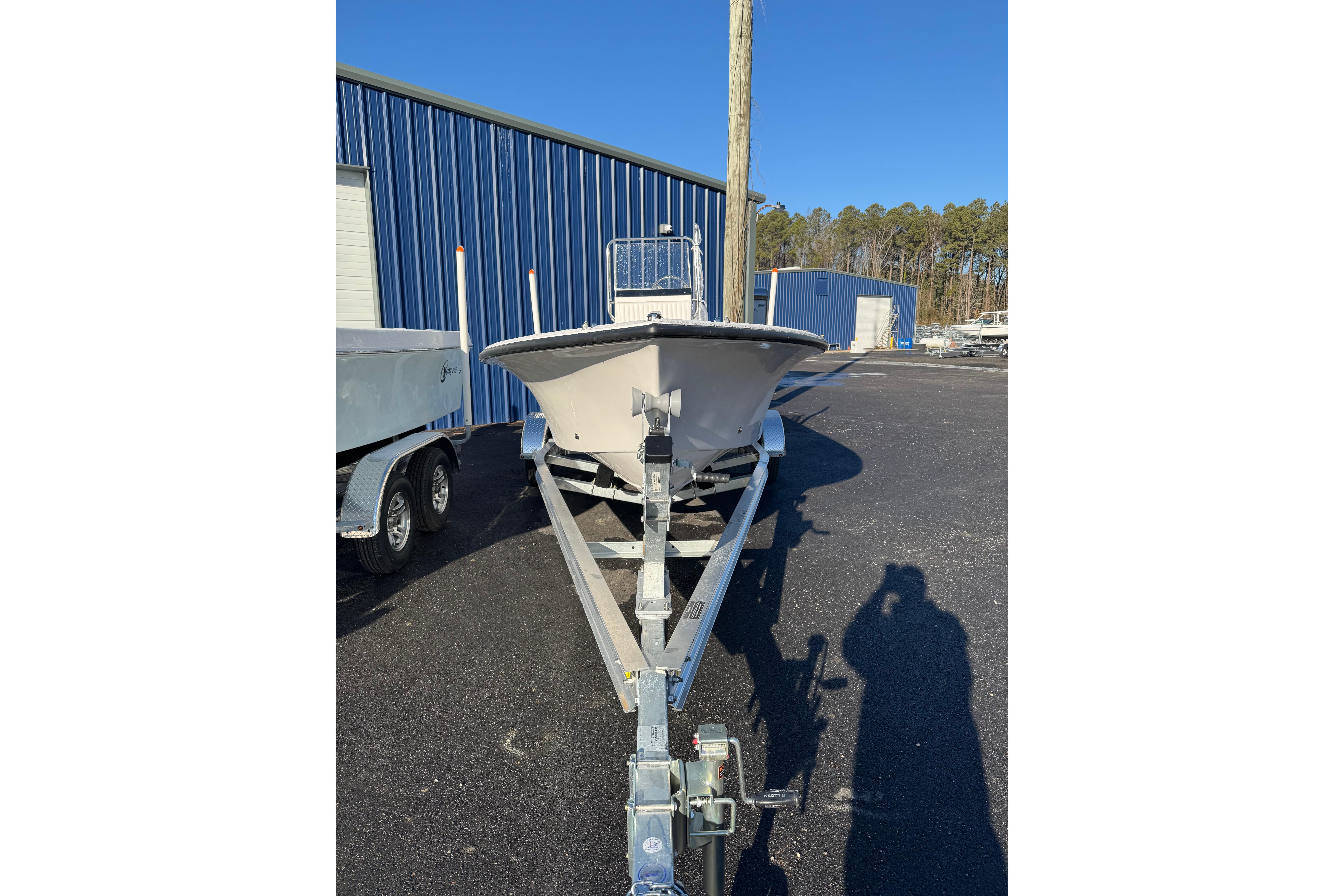 2026 C-Hawk 18 Center Console boat on trailer, parked outdoors.