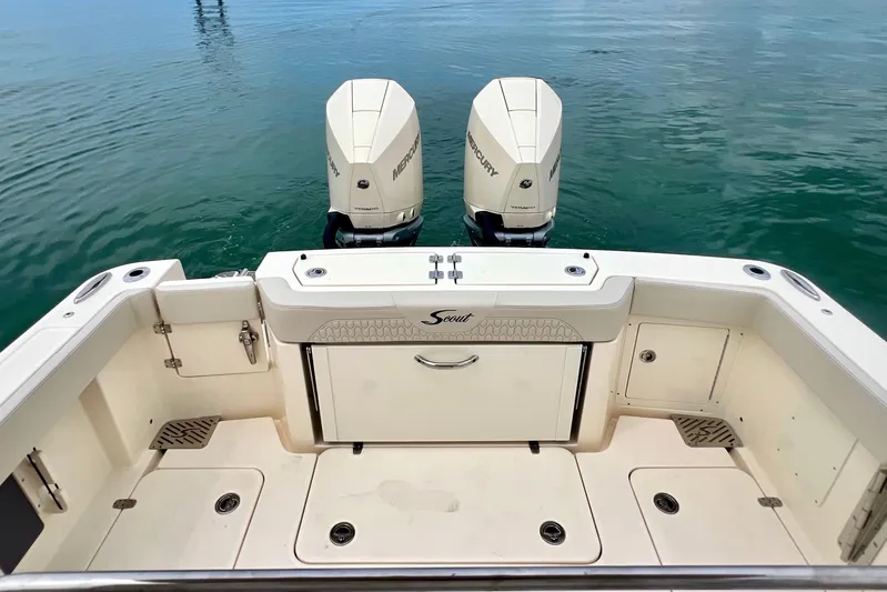  Yacht Photos Pics 2026 Scout 288 LXF boat with twin Mercury engines on calm water.