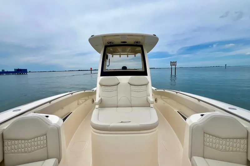  Yacht Photos Pics 2026 Scout 288 LXF boat interior with luxurious seating on calm water.