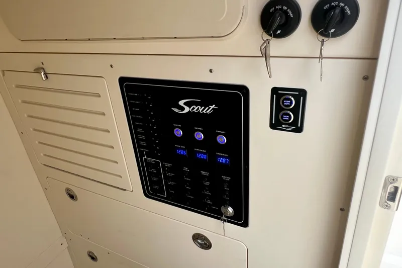  Yacht Photos Pics Control panel of 2026 Scout 288 LXF boat with switches and keys.