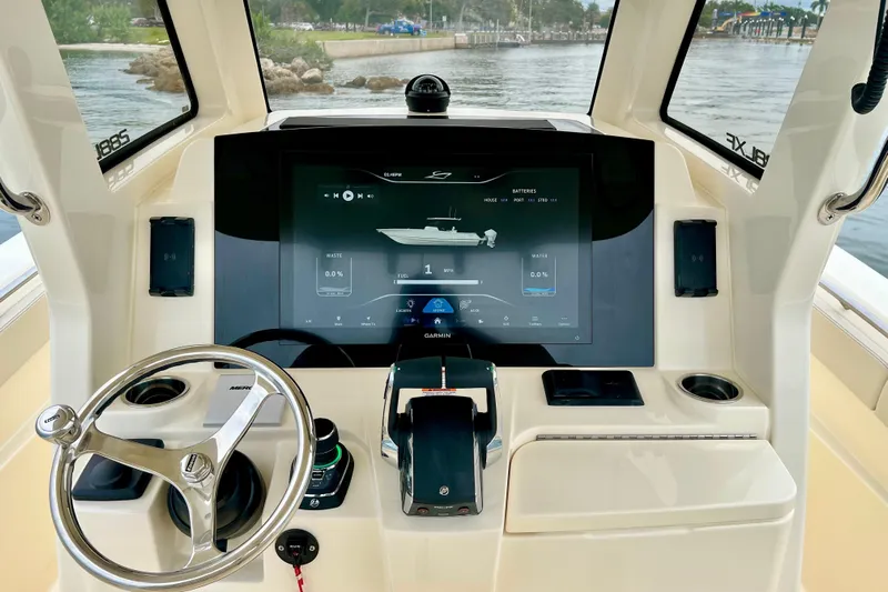  Yacht Photos Pics 2026 Scout 288 LXF boat dashboard with advanced navigation display and steering wheel.