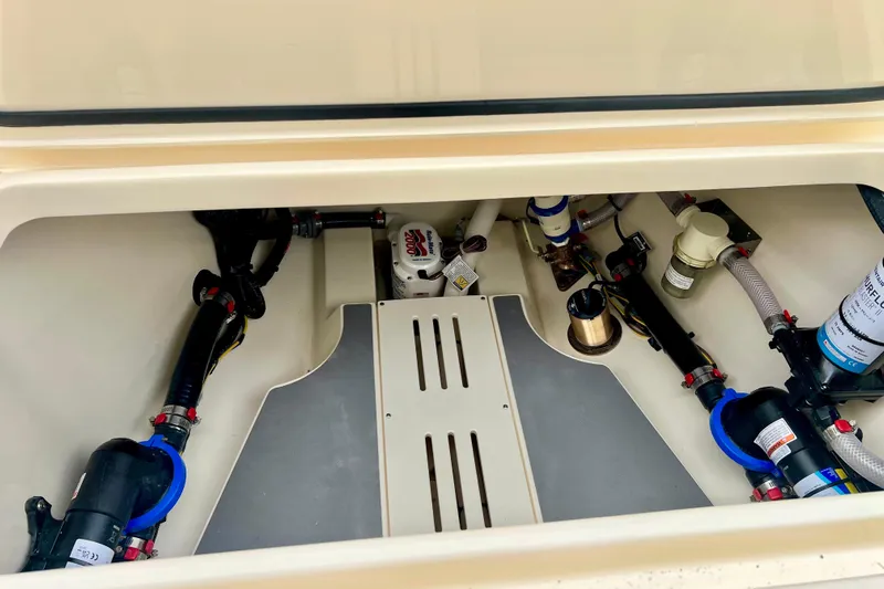  Yacht Photos Pics Engine compartment of 2026 Scout 288 LXF boat, showcasing mechanical components and systems.