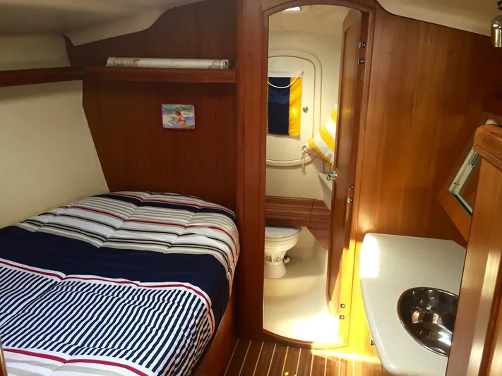 Sapphire Yacht Photos Pics 2007 Hunter 41 Deck Salon interior with cozy cabin, bed, and bathroom.