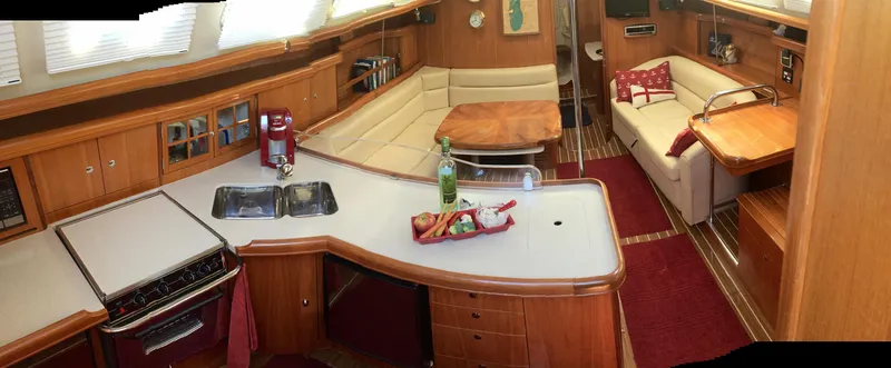 Sapphire Yacht Photos Pics Interior of 2007 Hunter 41 Deck Salon with kitchen and seating area.
