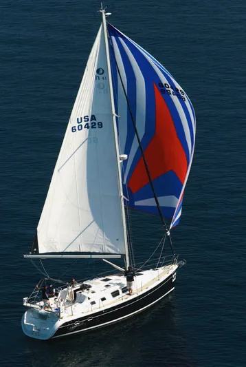 Sapphire Yacht Photos Pics 2007 Hunter 41 Deck Salon sailboat with colorful spinnaker on open water.