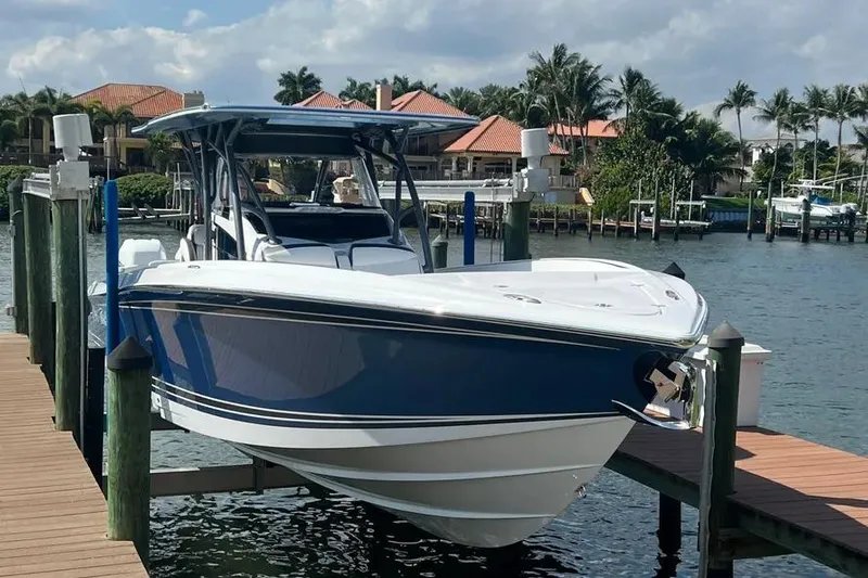  Yacht Photos Pics 2023 Nor-Tech 340 Sport Open Center Console docked by waterfront homes.