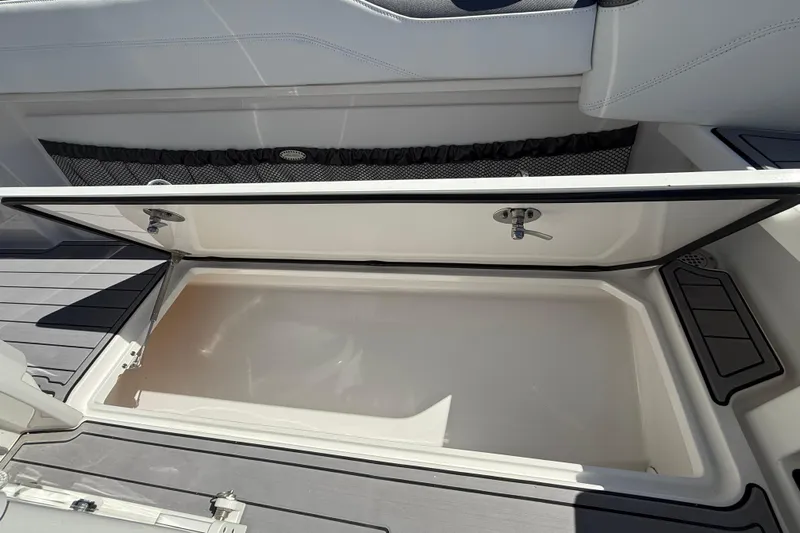  Yacht Photos Pics 2023 Nor-Tech 340 Sport Open Center Console storage compartment, open and empty.