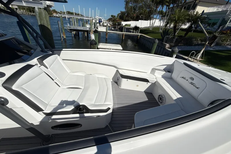  Yacht Photos Pics 2023 Nor-Tech 340 Sport Open Center Console with luxurious seating and waterfront view.