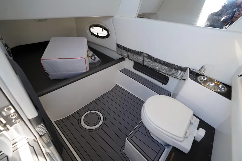  Yacht Photos Pics 2023 Nor-Tech 340 Sport Open Center Console interior with toilet and sink.