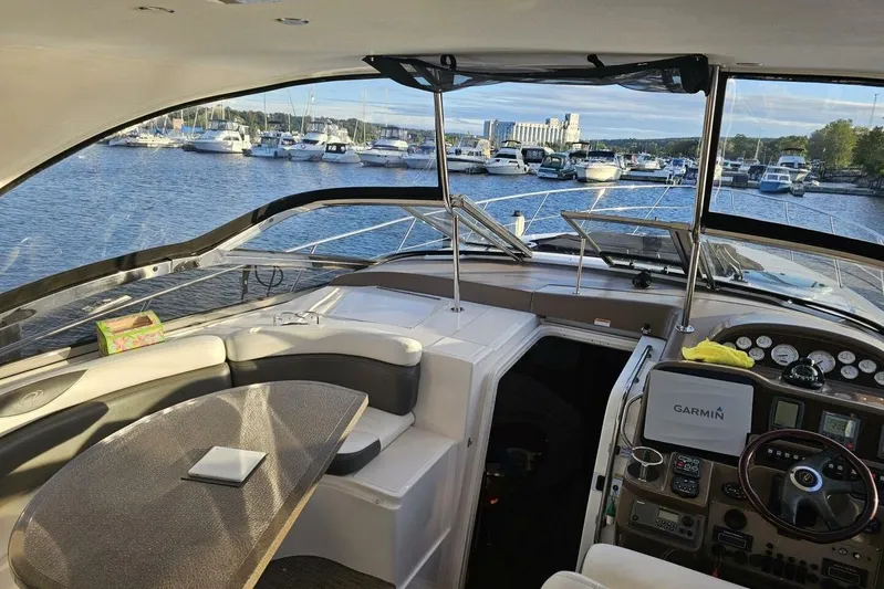  Yacht Photos Pics Interior view of 2005 Regal Commodore 4260 yacht with marina backdrop.